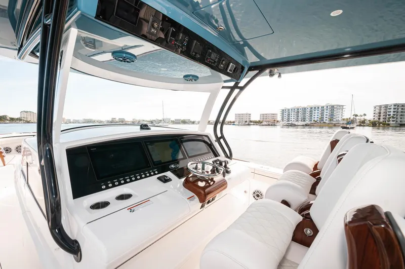 Slide: The Image of 2022 Valhalla Boatworks V46 Center Console helm station with modern controls and luxurious seating. - 15