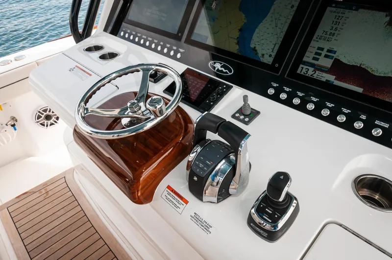 Slide: The Image of 2022 Valhalla Boatworks V46 Center Console helm with advanced navigation displays and controls. - 17