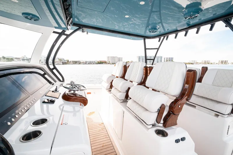 Slide: The Image of 2022 Valhalla Boatworks V46 Center Console interior with luxurious seating and modern controls. - 19