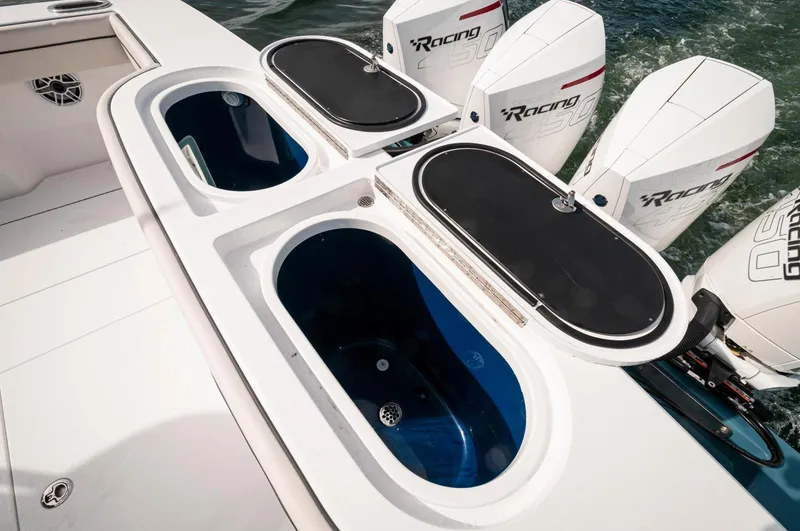 Slide: The Image of 2022 Valhalla Boatworks V46 Center Console with triple Racing outboard engines. - 21