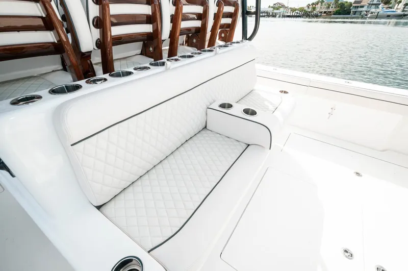 Slide: The Image of 2022 Valhalla Boatworks V46 Center Console, luxurious white seating with cup holders. - 22