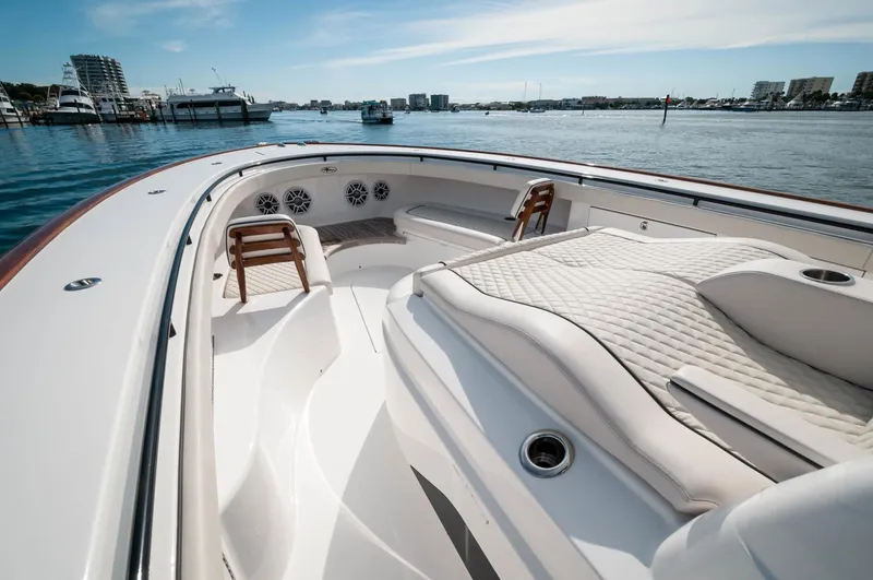 Slide: The Image of 2022 Valhalla Boatworks V46 Center Console, luxurious seating, and spacious deck on the water. - 24