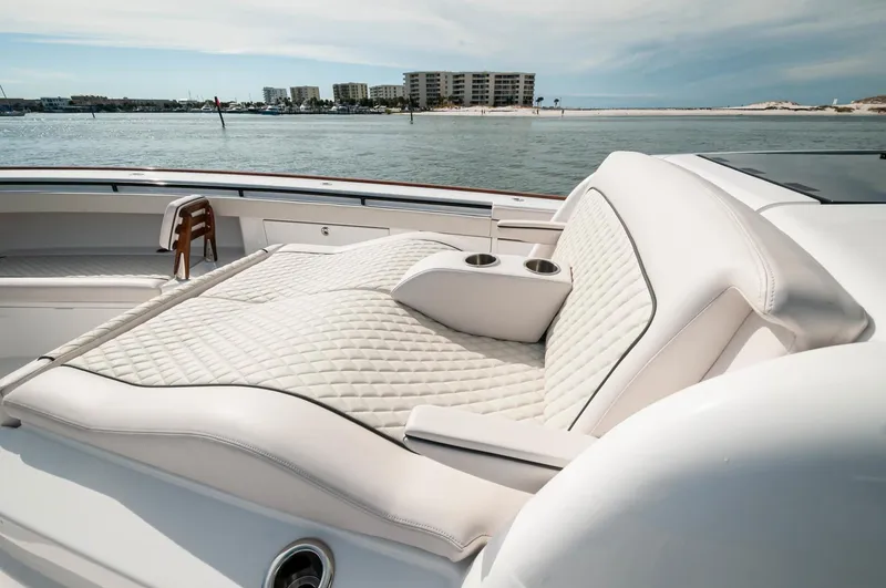 Slide: The Image of 2022 Valhalla Boatworks V46 Center Console with luxurious seating on a sunny day. - 25