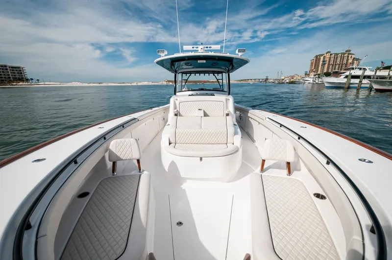 Slide: The Image of 2022 Valhalla Boatworks V46 Center Console on water, luxurious seating, clear sky. - 27