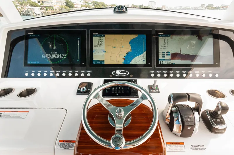 Slide: The Image of 2022 Valhalla Boatworks V46 Center Console helm with advanced navigation displays. - 3