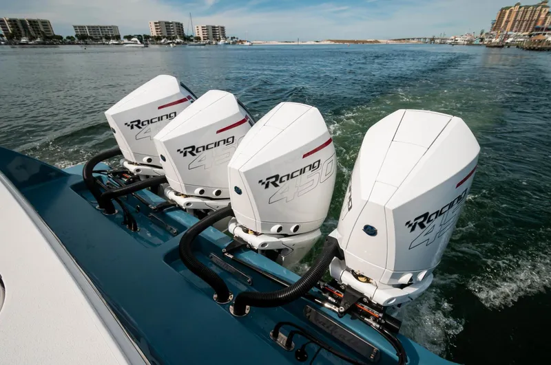 Slide: The Image of 2022 Valhalla Boatworks V46 Center Console with triple outboard engines on water. - 31