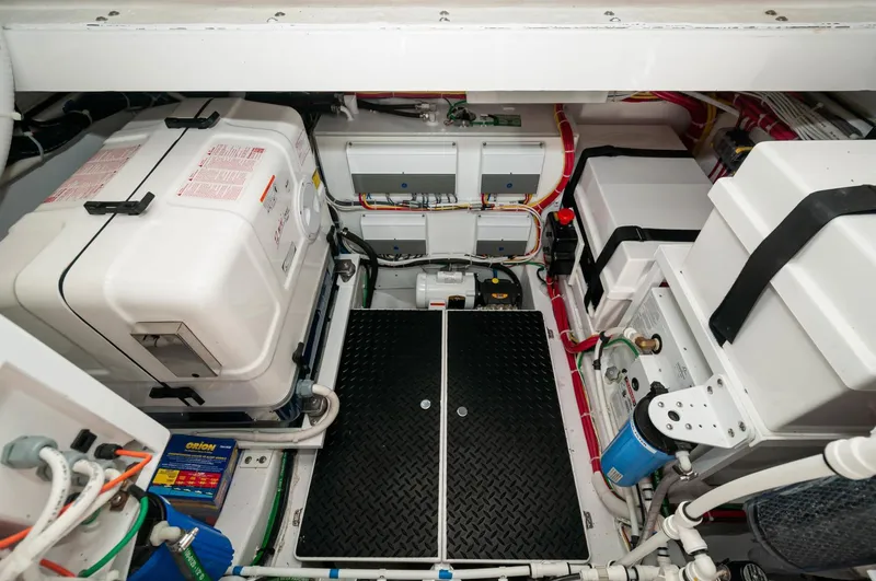 Slide: The Image of 2022 Valhalla Boatworks V46 Center Console engine room with advanced equipment and wiring. - 32