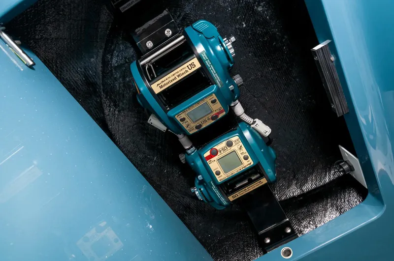 Slide: The Image of Electric fishing reels on a 2022 Valhalla Boatworks V46 Center Console. - 33