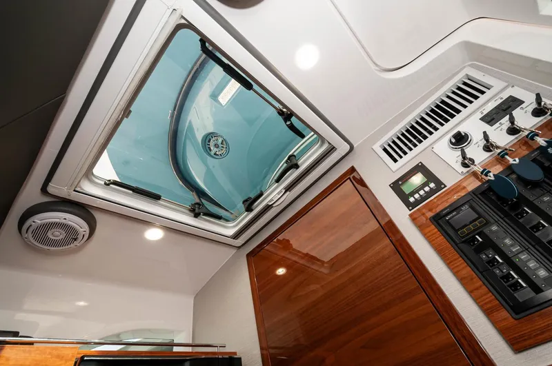 Slide: The Image of Interior view of 2022 Valhalla Boatworks V46 Center Console cabin with hatch and control panel. - 6