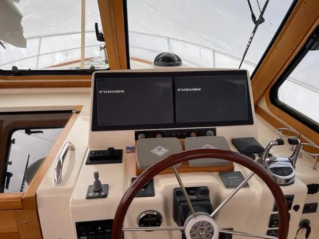 Slide: The Image of 2006 Sabre 38 Hard Top Express helm with Furuno navigation displays. - 10