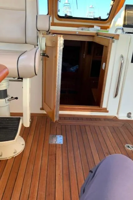 Slide: The Image of Interior view of 2006 Sabre 38 Hard Top Express yacht with open cabin door. - 14