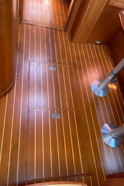 Slide: The Image of 2006 Sabre 38 Hard Top Express interior with polished wooden flooring. - 16