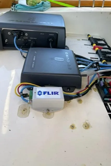 Slide: The Image of FLIR and Raymarine electronics on a 2006 Sabre 38 Hard Top Express boat. - 20