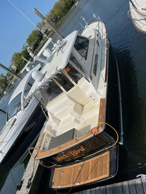 Slide: The Image of 2006 Sabre 38 Hard Top Express docked at a marina. - 23