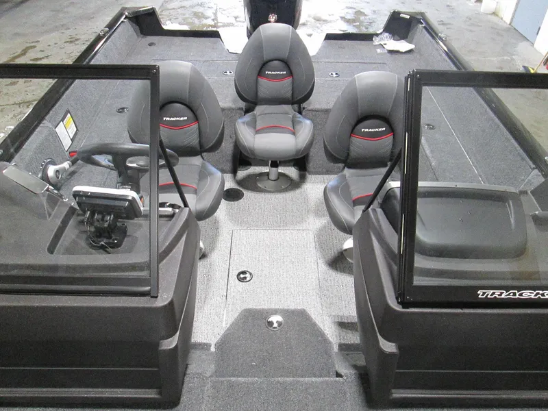 Slide: The Image of 2023 Tracker Pro Guide V-175 WT boat interior with seating and console. - 11