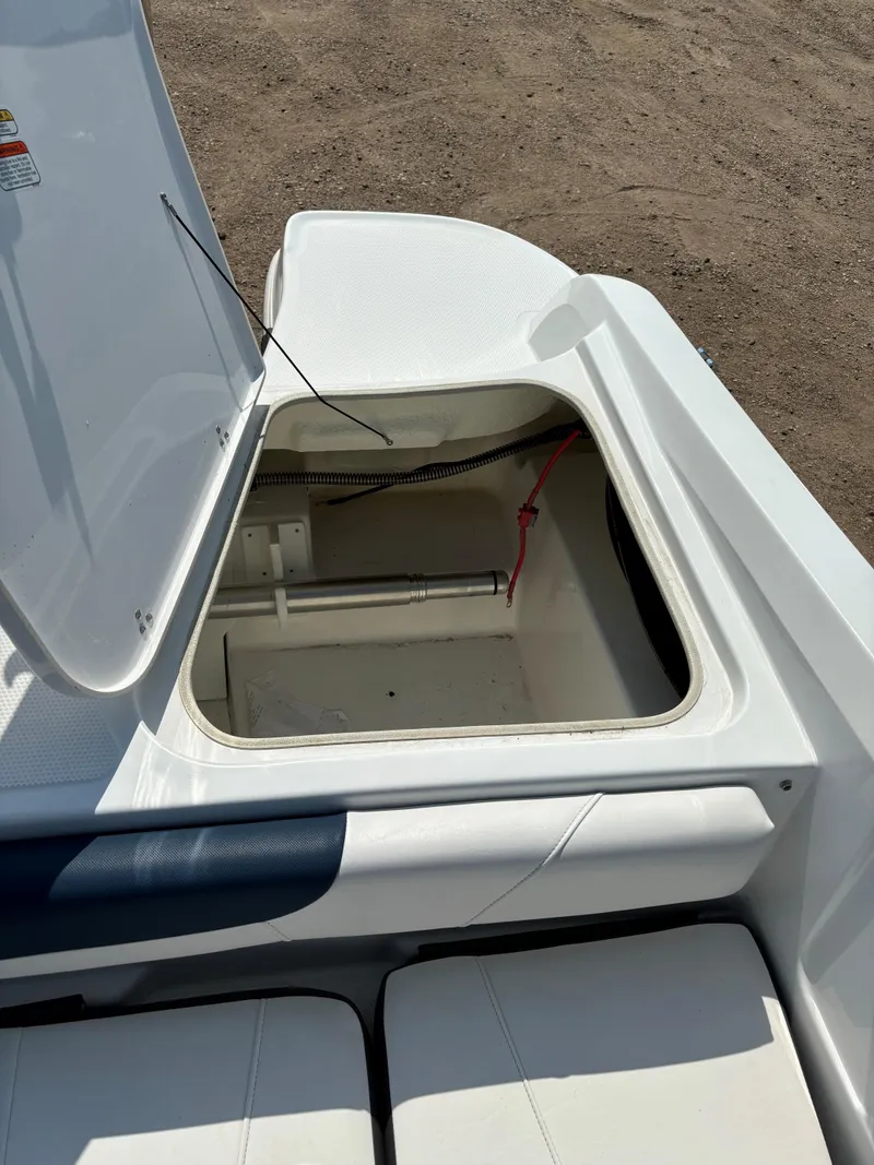 Slide: The Image of 2023 Tahoe 185 S boat storage compartment open on deck. - 10