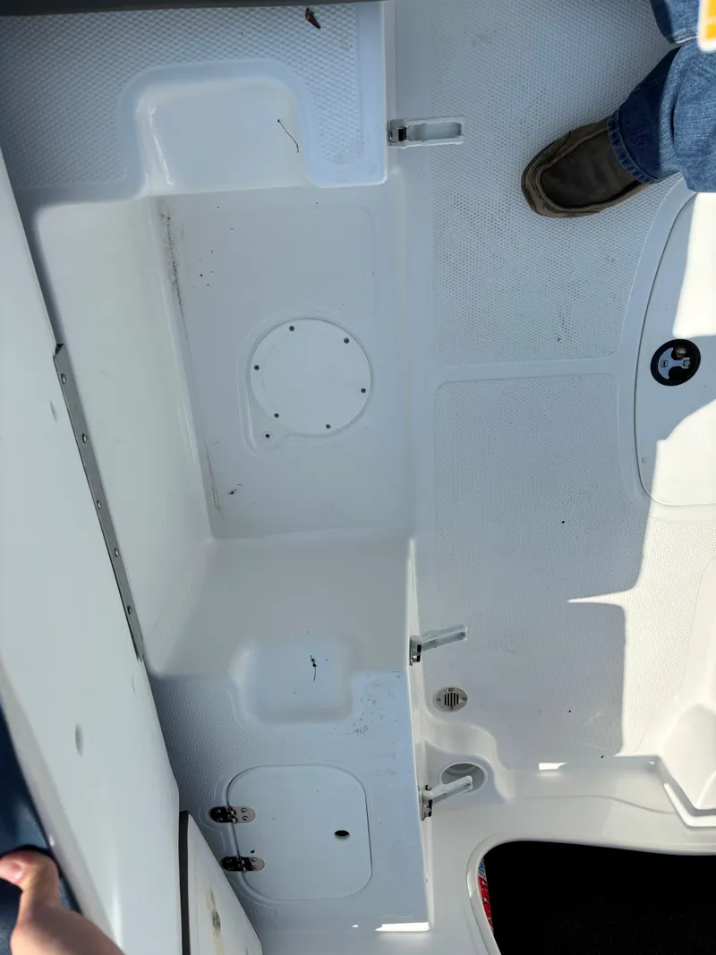 Slide: The Image of 2023 Tahoe 185 S boat interior with white deck and seating area. - 12