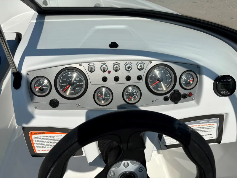 Slide: The Image of Dashboard of 2023 Tahoe 185 S boat with gauges and controls. - 15