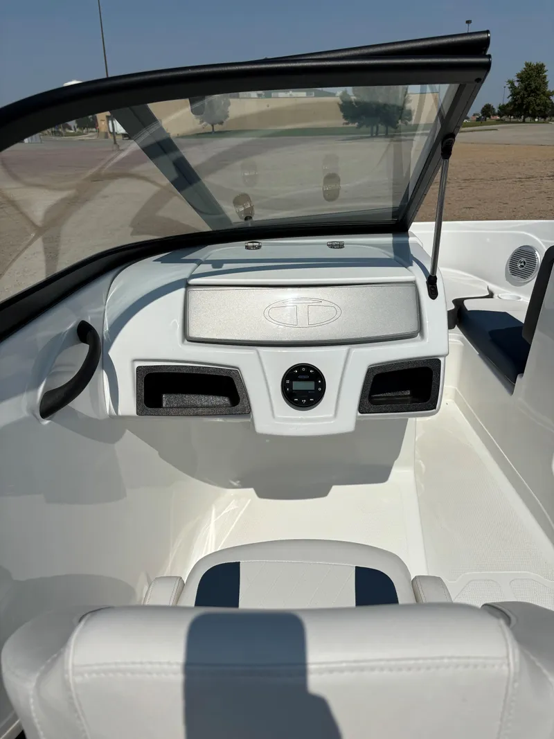 Slide: The Image of 2023 Tahoe 185 S boat interior with sleek white dashboard and seating. - 16