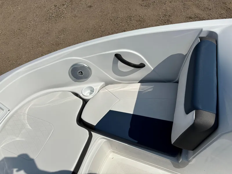 Slide: The Image of 2023 Tahoe 185 S boat interior with cushioned seating and speaker. - 19