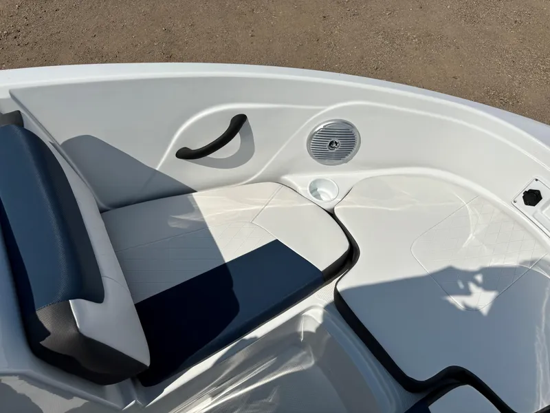 Slide: The Image of 2023 Tahoe 185 S boat interior with cushioned seating and speaker. - 20