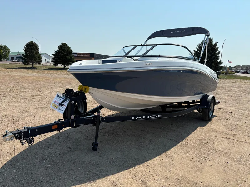 Slide: The Image of 2023 Tahoe 185 S boat on trailer in outdoor setting. - 3