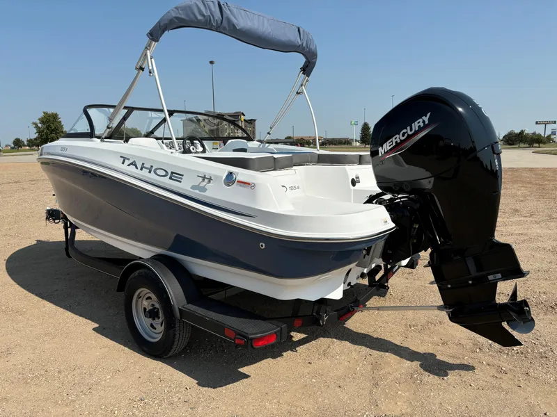 Slide: The Image of 2023 Tahoe 185 S boat with Mercury outboard motor on a trailer. - 4