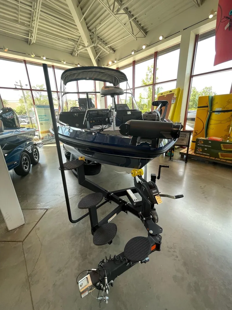 Slide: The Image of 2023 Nitro ZV20 Pro fishing boat displayed in a showroom. - 4