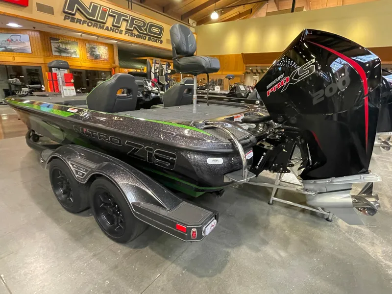 Slide: The Image of 2023 Nitro Z19 fishing boat with Mercury Pro XS 200 engine in showroom. - 2