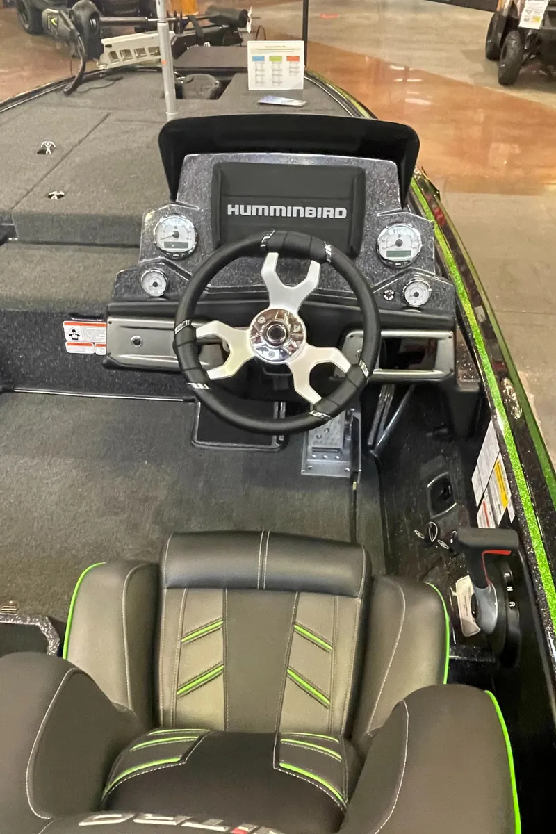 Slide: The Image of 2023 Nitro Z19 boat dashboard with Humminbird electronics and steering wheel. - 5