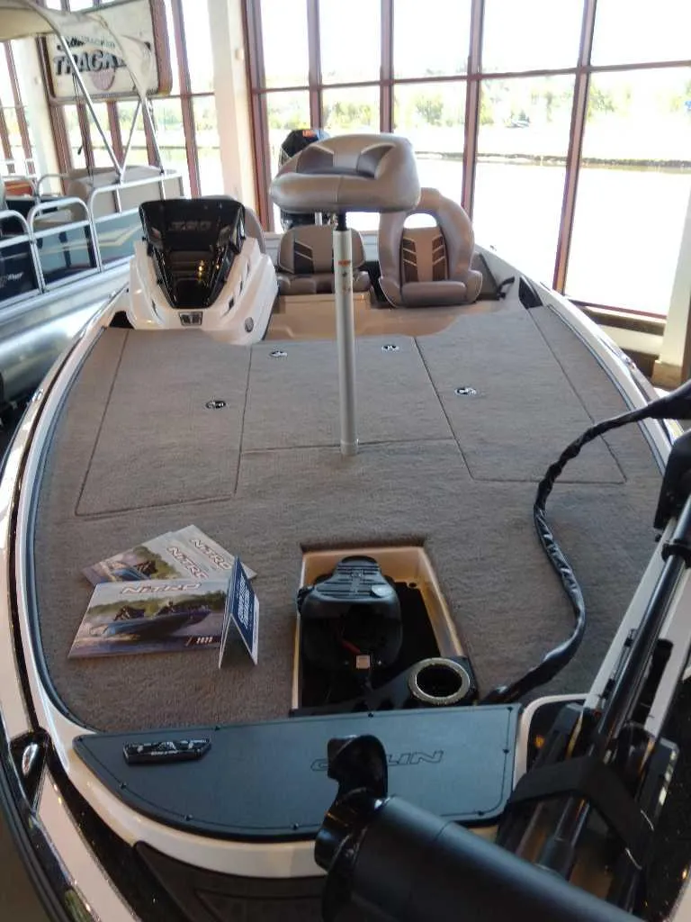 Slide: The Image of 2023 Nitro Z20 fishing boat interior with spacious deck and seating. - 13