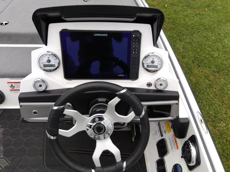 Slide: The Image of Nitro Z20 2023 boat dashboard with steering wheel and Lowrance display. - 5