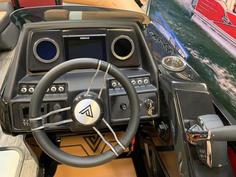 Slide: The Image of 2023 Viaggio Diamante 23 U boat dashboard with steering wheel and control panel. - 11