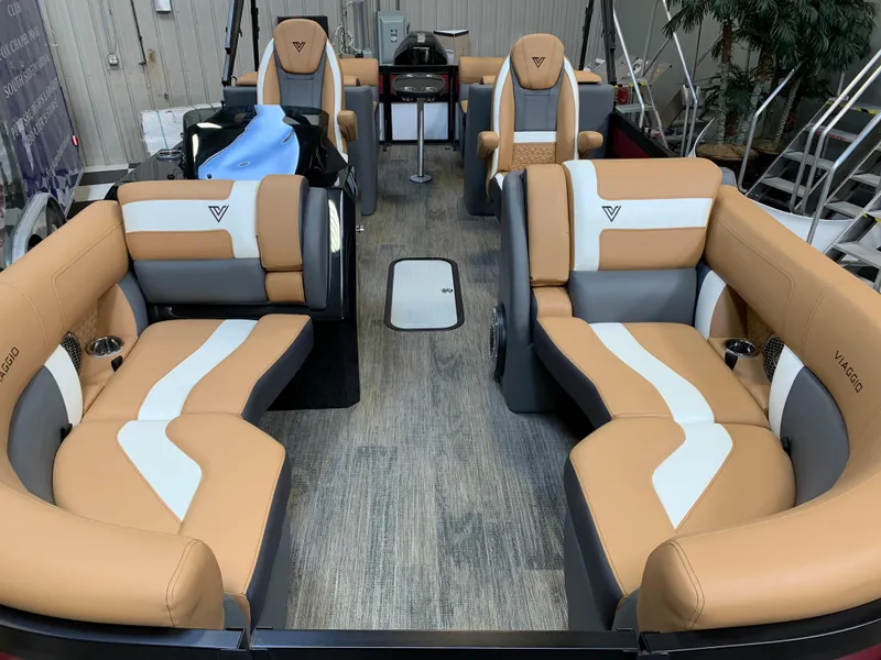 Slide: The Image of 2023 Viaggio Diamante 23 U boat interior with tan and white seating. - 16