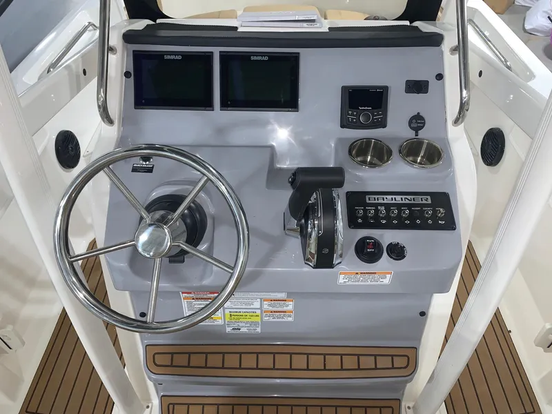 Slide: The Image of 2024 Bayliner Trophy 20 CC boat console with steering wheel and controls. - 6