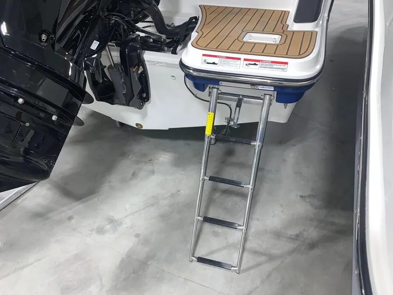 Slide: The Image of 2024 Bayliner Trophy 20 CC swim platform with ladder and outboard motor. - 4