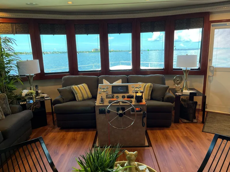 Slide: The Image of Interior of a 2009 Fantasy houseboat with panoramic windows and a steering console. - 21