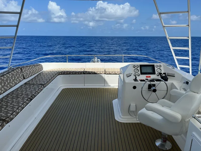 Slide: The Image of 2009 Fantasy Houseboat helm with ocean view and cushioned seating. - 24