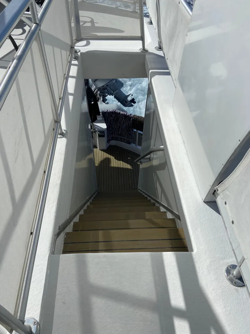 Slide: The Image of Staircase on a 2009 Fantasy Houseboat leading to the lower deck. - 32
