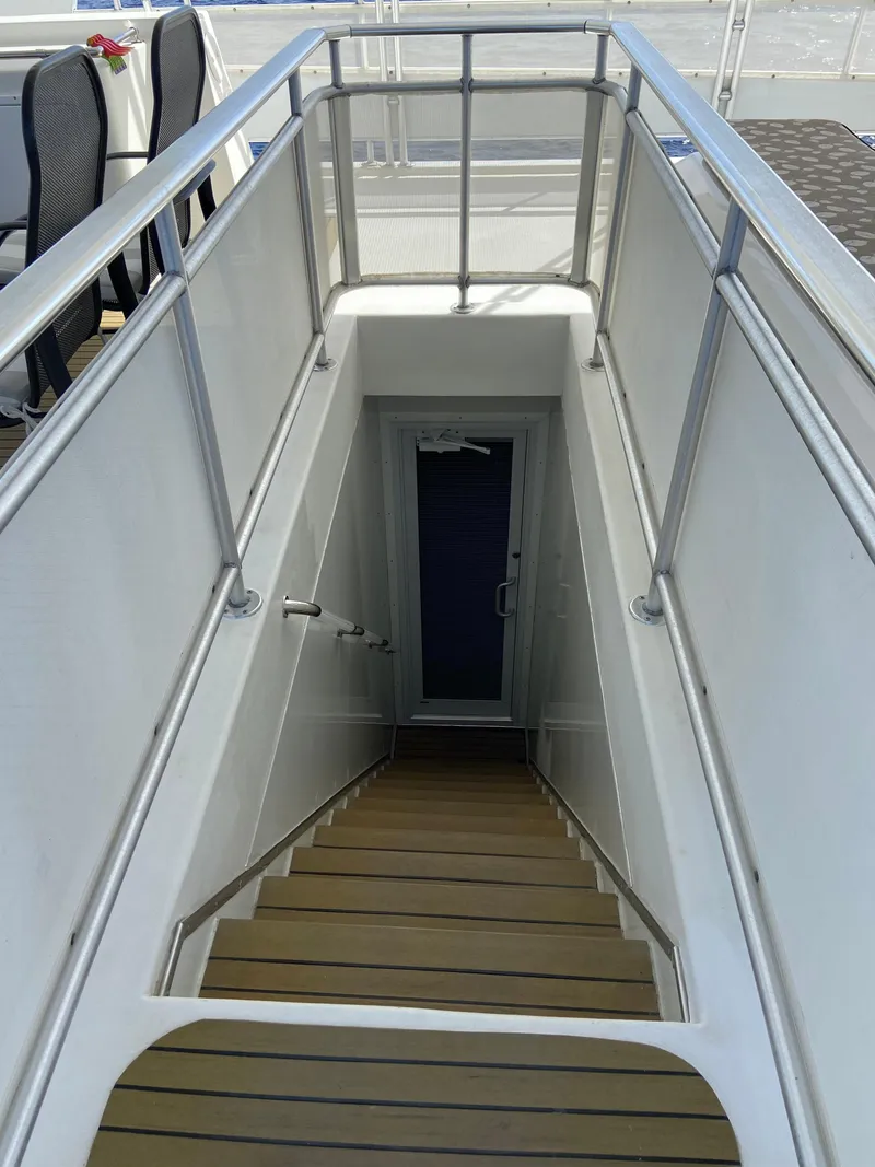Slide: The Image of Staircase on a 2009 Fantasy Houseboat leading to lower deck. - 33