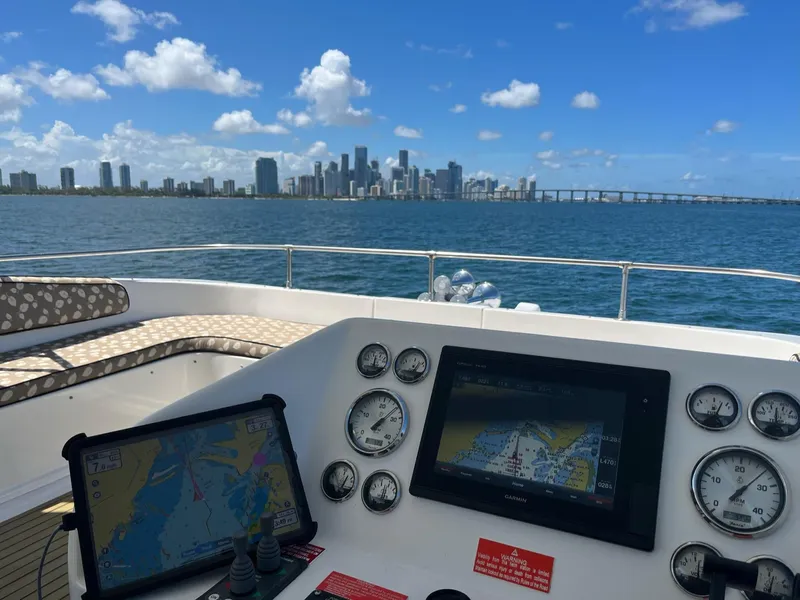 Slide: The Image of Control panel of a 2009 Fantasy Houseboat with city skyline in the background. - 37