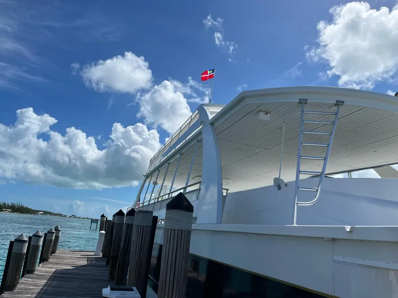 Slide: The Image of Modern 2009 Fantasy houseboat docked at a sunny marina with blue skies. - 6