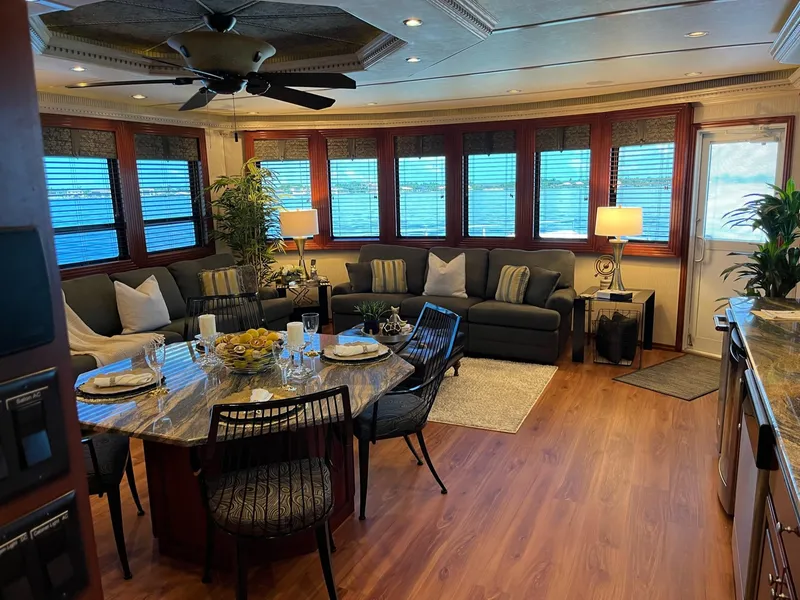 Slide: The Image of Luxurious 2009 Fantasy houseboat interior with modern furnishings, dining area, and large windows. - 7