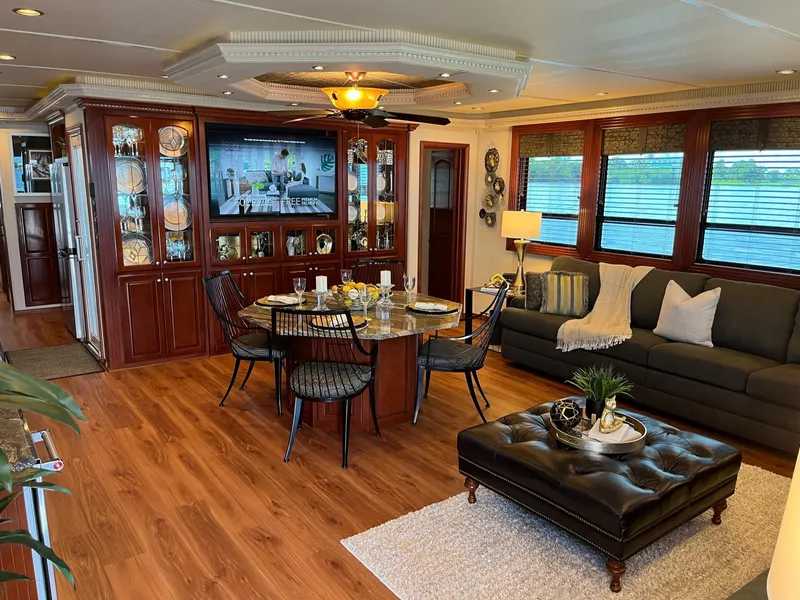 Slide: The Image of Luxurious 2009 Fantasy houseboat interior with elegant dining area, cozy living space, and stylish decor. - 8