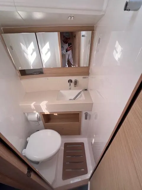 Slide: The Image of Modern bathroom in 2024 Dufour 470 yacht with sleek fixtures and wooden accents. - 11