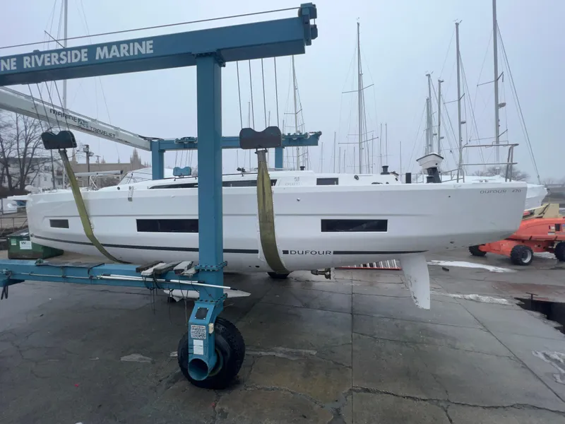 Slide: The Image of 2024 Dufour 470 sailboat on a marine lift at Riverside Marine. - 4