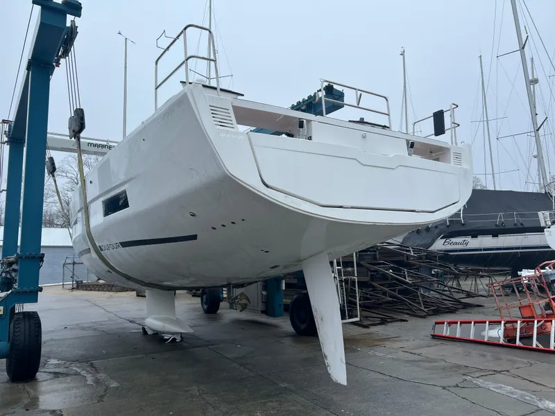 Slide: The Image of 2024 Dufour 470 sailboat on a boatyard lift, ready for launch. - 6
