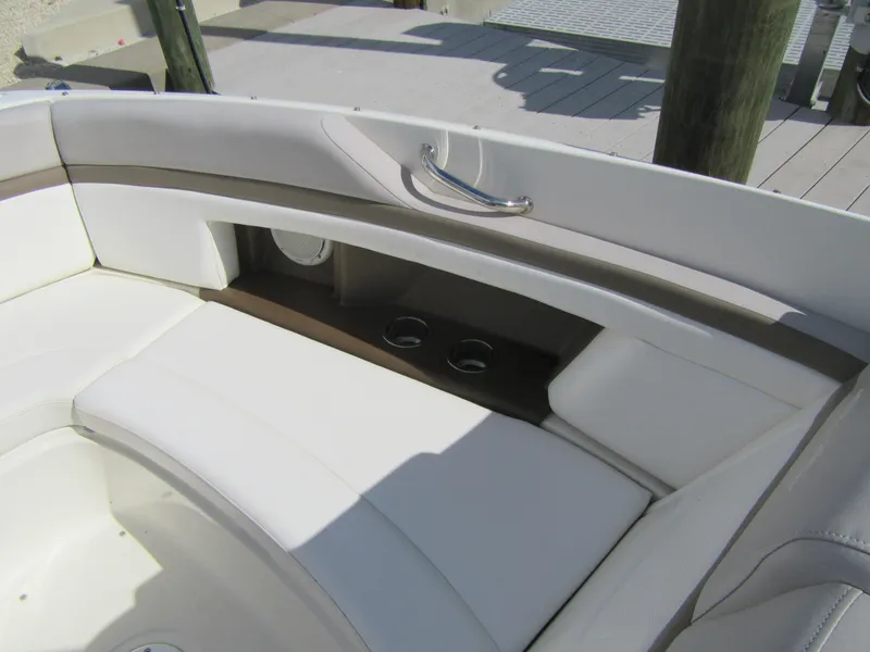 Slide: The Image of Interior seating of a 2011 Sea Ray 250 SLX boat with cup holders. - 16