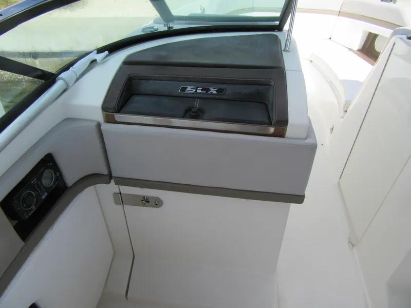 Slide: The Image of Interior of 2011 Sea Ray 250 SLX boat, featuring dashboard and seating area. - 29