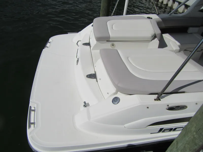 Slide: The Image of 2011 Sea Ray 250 SLX boat with white seating and swim platform. - 38